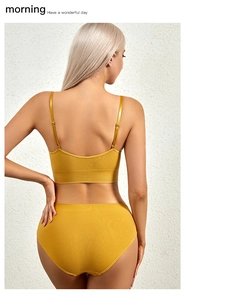 Back view of mustard yellow seamless lingerie set with U-back bra and ribbed texture