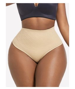Detailed view of high-waisted shaping underwear with diamond jacquard texture in beige