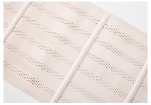 Close-up of breathable mesh fabric and vertical support bones on high waist trainer