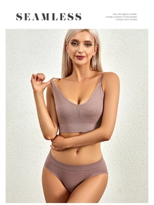 Detail view of pink seamless knit lingerie set with ribbed texture and thin straps