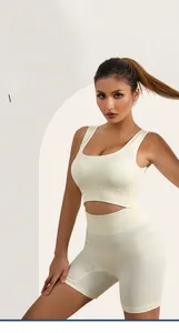 Detail of ribbed seamless sports bra and high-waist shorts set in cream color