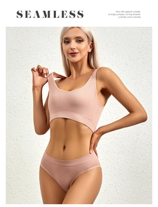 Detail of seamless dusty pink ribbed lingerie set showing texture and supportive fit