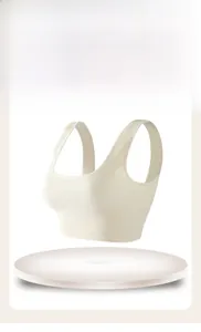 Close-up of cream ribbed sports bra with seamless high-elastic texture and U-neckline