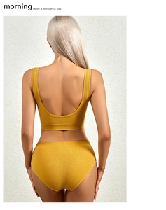 Detail view of yellow ribbed seamless lingerie set with U-shaped back design and soft fabric