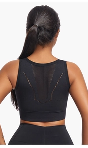 Close-up of women's sports bra featuring a breathable mesh back and V-shaped perforations