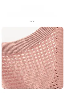 Macro shot of breathable micro-hole knitted fabric on pink sports bra with ribbed edges