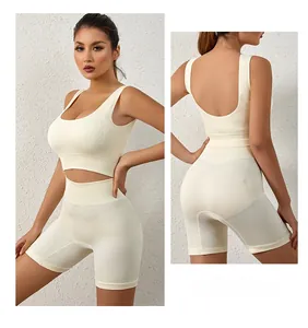 Detail of ribbed beige sports set featuring U-neck tank top and high-waisted shorts