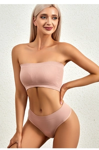 Detail of seamless ribbed lingerie set in soft dusty pink showing fine texture