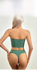 Detail view of seamless dark green ribbed lingerie set showing elastic back fit