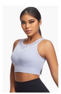 Close-up of lilac sports bra with V-shaped mesh vents and wide ribbed hem detail