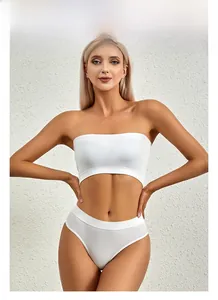 Close-up of white ribbed fabric texture on seamless crop top and high-cut lingerie set