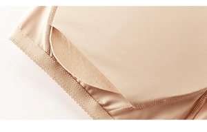 Macro detail of high-elasticity skin-tone fabric with precision stitching and dual-layer pockets
