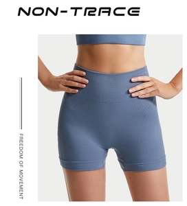 Dettaglio dei pantaloncini da yoga senza cuciture blu con ampia fascia a vita alta