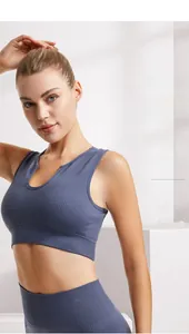 Detail of dark blue ribbed sports bra with removable pads and supportive wide waistband