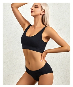Close-up of black ribbed seamless wireless bra and matching briefs with wide straps