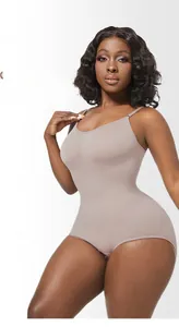 Detail of seamless plus size bodysuit showing lifting and shaping effect in dusty rose