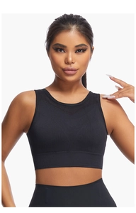 Detail of black sports bra with breathable mesh cutout and wide elastic ribbed underband