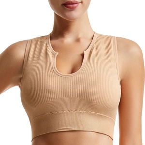 Front view of a beige ribbed knit sports bra with a notched neckline and wide waistband