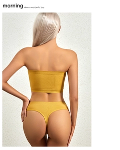 Rear view of ginger yellow ribbed knit lingerie set featuring thin straps and low back