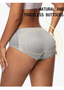 Detail of padded butt lifting underwear showing breathable mesh and lace trim with arrows