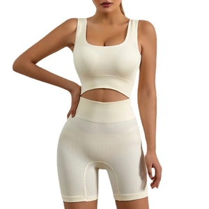 Cream ribbed seamless workout set featuring a U-neck sports bra and high-waist shorts