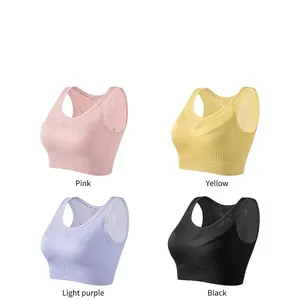 Seamless sports bra set with breathable cut-outs in pink, yellow, purple, and black colors