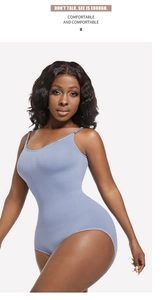 Close-up of seamless light blue shaping bodysuit fabric on female model with thin straps