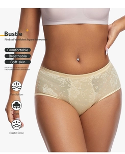 Detail of floral lace mesh underwear with breathable fabric and scallop edges in beige