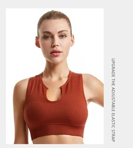 Detail of caramel ribbed sports bra showing adjustable elastic straps and U-neckline