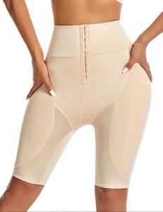 Detailed macro view of the adjustable multi-row metal buckles on high waist shaping shorts