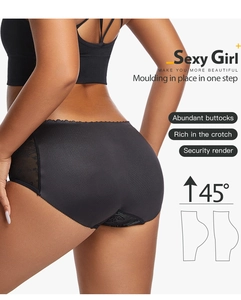 Detail view of black padded lace hip enhancer panties showing lifting effect and lace trim