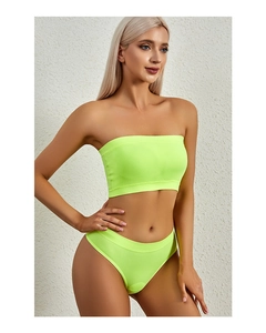 Detail of neon green ribbed seamless lingerie set showing stretch fabric texture