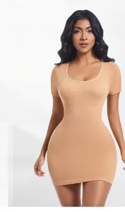 Detailed view of beige seamless ribbed knit dress showing high elasticity and slim fit texture