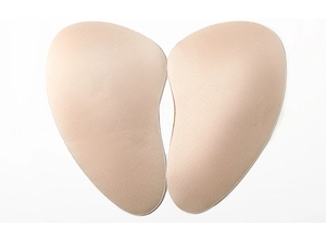 Pair of beige padded foam inserts with anatomical curves for body shaping garments