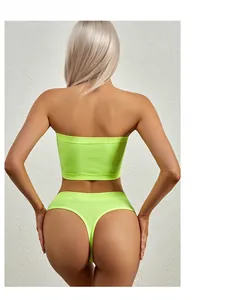 Detailed back view of neon green ribbed tube top and matching thong set for women