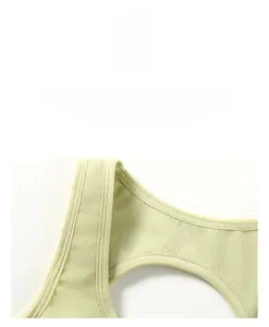 Detailed macro view of light green ribbed knit fabric with reinforced stitching seams