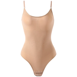 Seamless tummy control bodysuit in beige with adjustable straps and compression panels