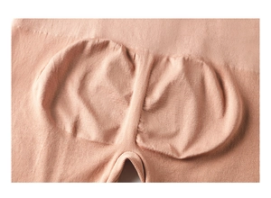 Close-up of seamless ribbed fabric and butt-lifting seam design on nude shapewear