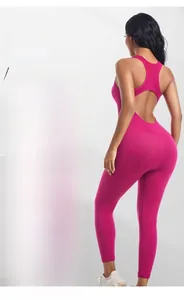 Detail of rose pink ribbed bodysuit featuring back oval cutout and wide racing straps
