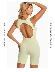 Detail of light green seamless yoga bodysuit showing the open back and ribbed texture