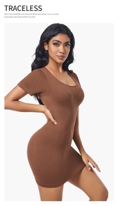 Detail of dark brown ribbed knit dress showing slim fit cut and seamless texture