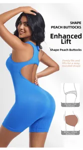 Detail view of sapphire blue ribbed fitness jumpsuit featuring backless peach buttocks design
