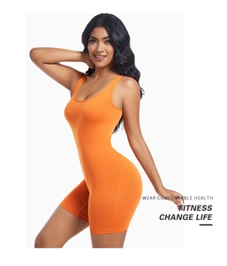 Close-up of bright orange one-piece sports bodysuit with U-neck and elastic fabric
