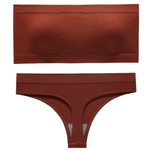 Seamless ribbed bra and thong set in terracotta red with a minimalist strapless design