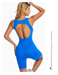 Detail of blue backless yoga bodysuit showing wide straps and circular cutout design