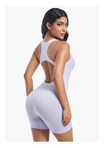 Detail of lavender ribbed yoga romper featuring racerback design and bodycon fit