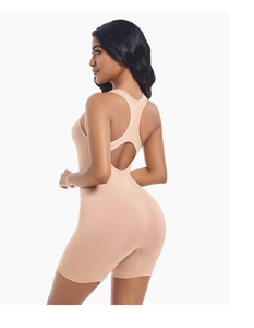 Detail of nude athletic bodysuit featuring racerback design and teardrop cutout