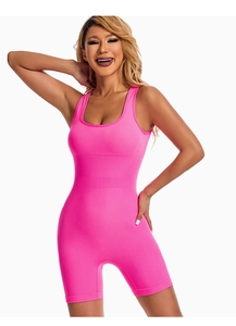 Detail view of pink ribbed yoga bodysuit featuring slim fit cut and U-neckline