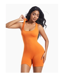 Close-up of bright orange athletic bodysuit featuring a U-neckline and ribbed fabric