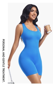 Detail of blue ribbed yoga bodysuit featuring a sleeveless U-neck and bodycon fit